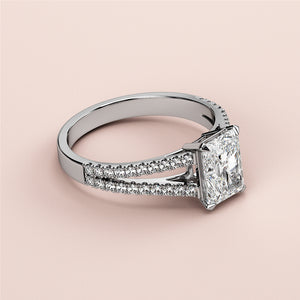 Elegant 14K/18K white gold engagement ring featuring a radiant-cut diamond andPave-set band, not worn on a model.