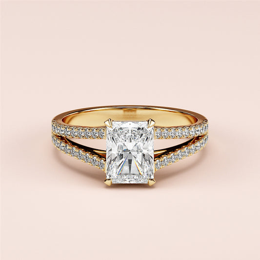Elegant split shank engagement ring with radiant cut diamond in 14K or 18K gold or platinum, adorned withPave-set diamonds.