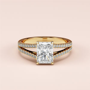 Elegant split shank engagement ring with radiant cut diamond in 14K or 18K gold or platinum, adorned withPave-set diamonds.