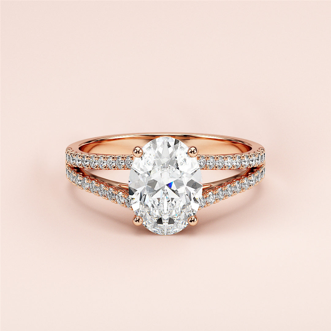 Elegant 14K or 18K rose gold engagement ring featuring oval diamond in split shank band adorned with smaller diamonds.|







#14KRecycledRoseGold
#18KRecycledRoseGold


