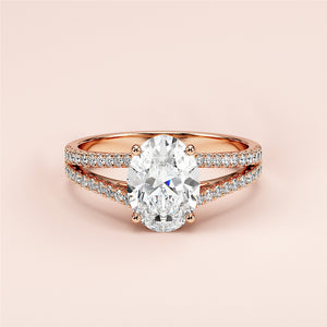 Elegant 14K or 18K rose gold engagement ring featuring oval diamond in split shank band adorned with smaller diamonds.