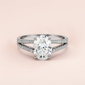 Elegant oval-shaped diamond engagement ring with split shank design in 14K or 18K gold or platinum, exemplifying luxury and craftsmanship.