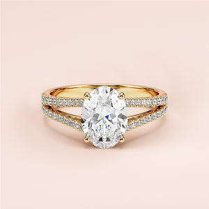 Elegant yellow gold oval-cut diamond engagement ring with split shank andPave accents, available in 14K, 18K, or platinum.