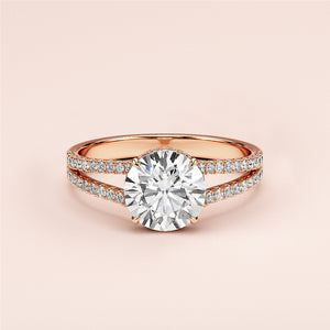 Elegant 14K rose gold engagement ring featuring a round cut diamond, split shank band, and sparklingPave diamonds.