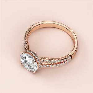 Elegant rose gold engagement ring with hidden halo, featuringPave diamonds on a split shank band, in 14K or 18K options.