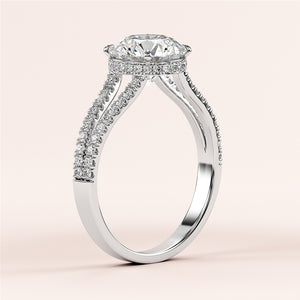 Stunning 14K white gold engagement ring with round hidden halo, split shank, and pave-set diamonds. Perfect for your special moment.