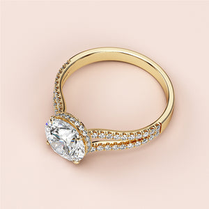 Elegant oval diamond engagement ring in 14K yellow gold with split shank and hidden halo, featuring double row ofPave diamonds.