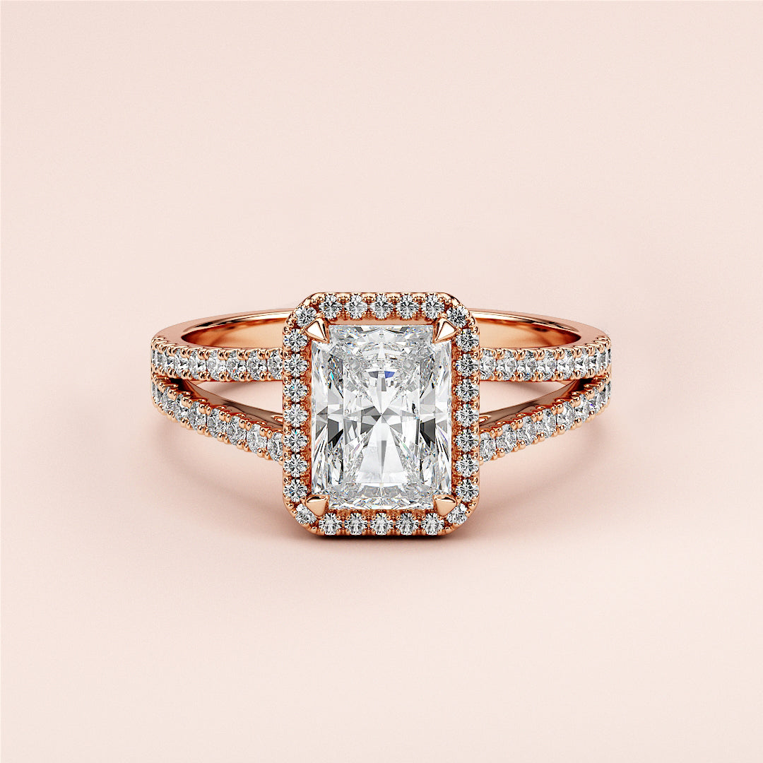 Elegant 14K or 18K rose gold engagement ring with radiant-cut diamond, split shank, andPave-set accents for sophisticated style.