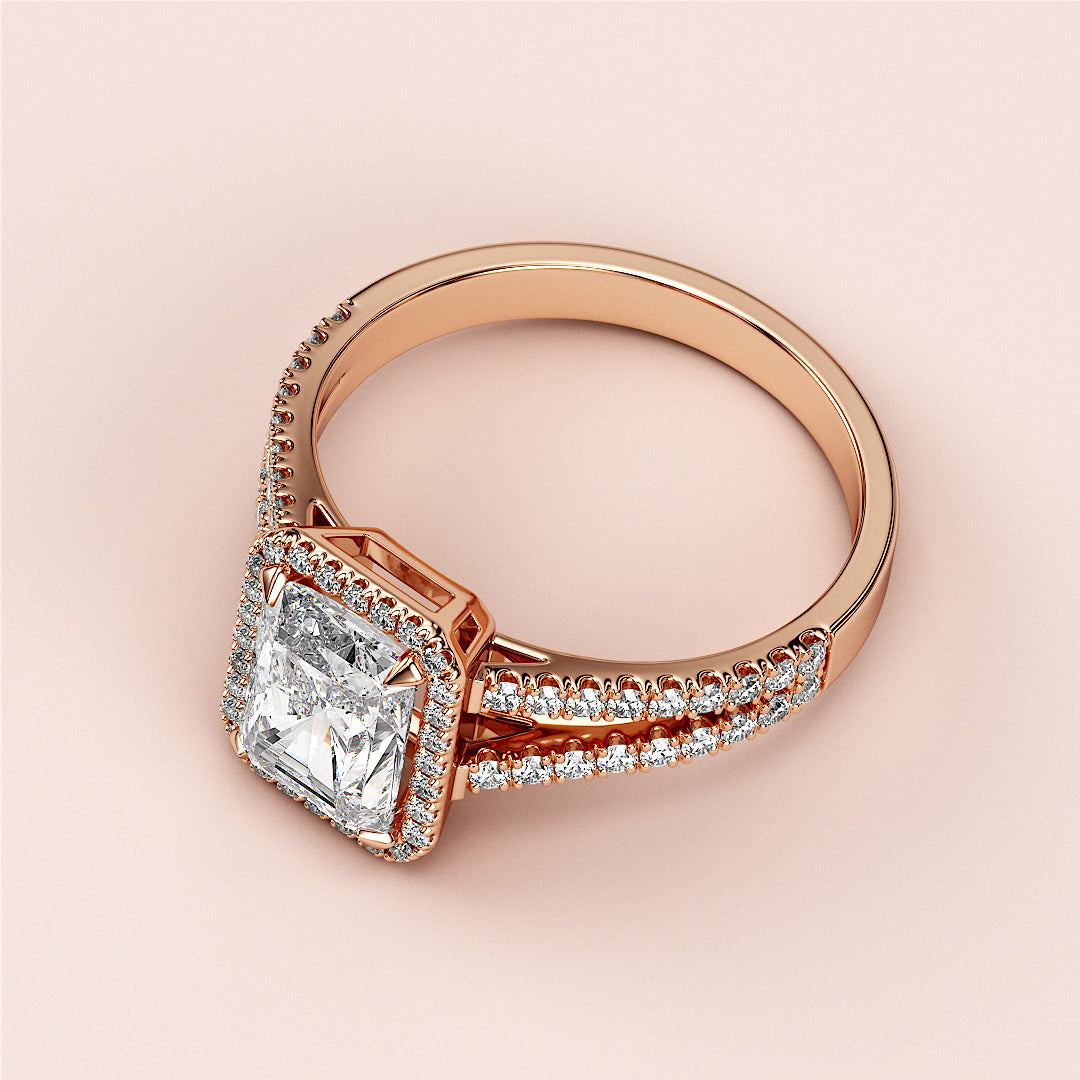 Elegant square-cut diamond engagement ring with halo, crafted in 14K/18K rose gold, showcased on a soft pink background.