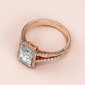 Elegant square-cut diamond engagement ring with halo, crafted in 14K/18K rose gold, showcased on a soft pink background.