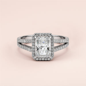 Radiant cut diamond engagement ring with split shank and halo setting, available in 14K and 18K gold or platinum.