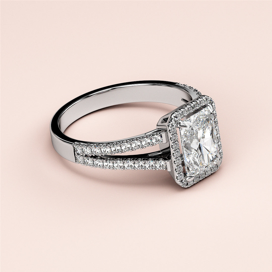 Elegant 14K white gold engagement ring featuring a radiant-cut diamond halo andPave-set diamonds, designed for timeless sophistication.