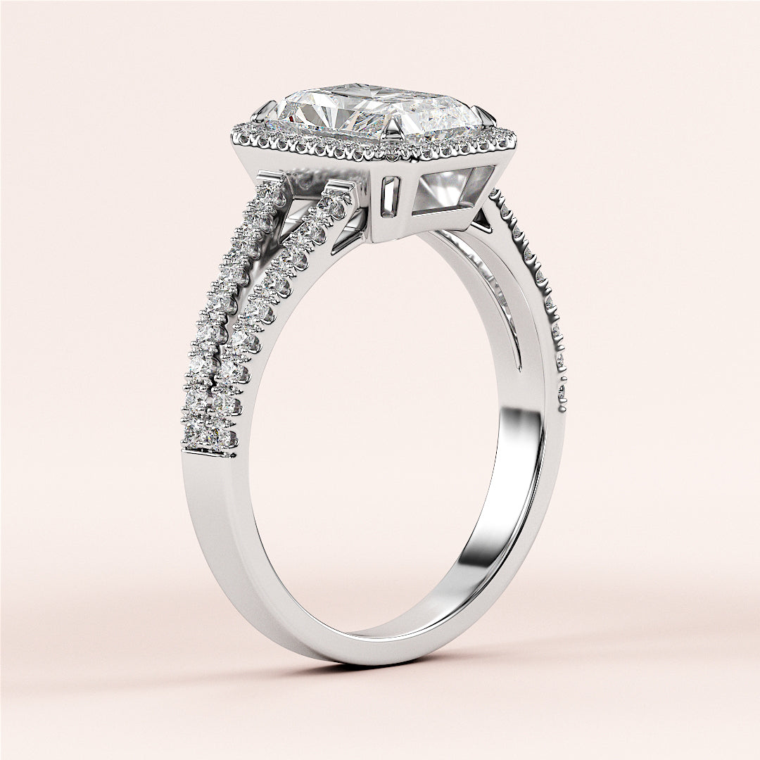 14K white gold diamond engagement ring with emerald-cut center stone and pave-set diamonds on split shank cathedral band.