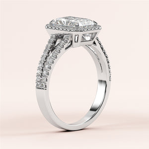 14K white gold diamond engagement ring with emerald-cut center stone and pave-set diamonds on split shank cathedral band.