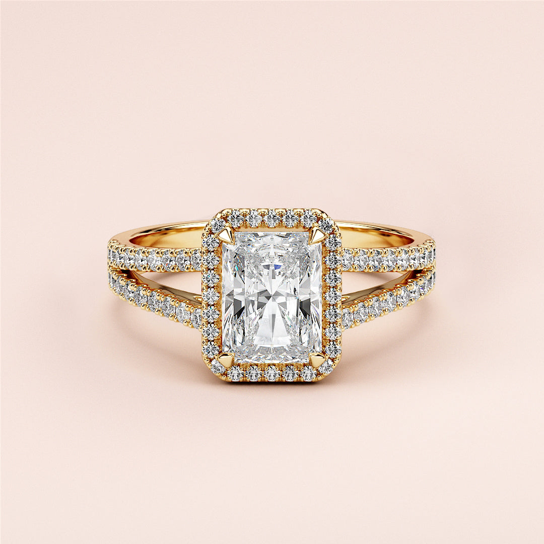 Elegant 14K/18K gold or platinum radiant halo split shank engagement ring with diamond center andPave accents.