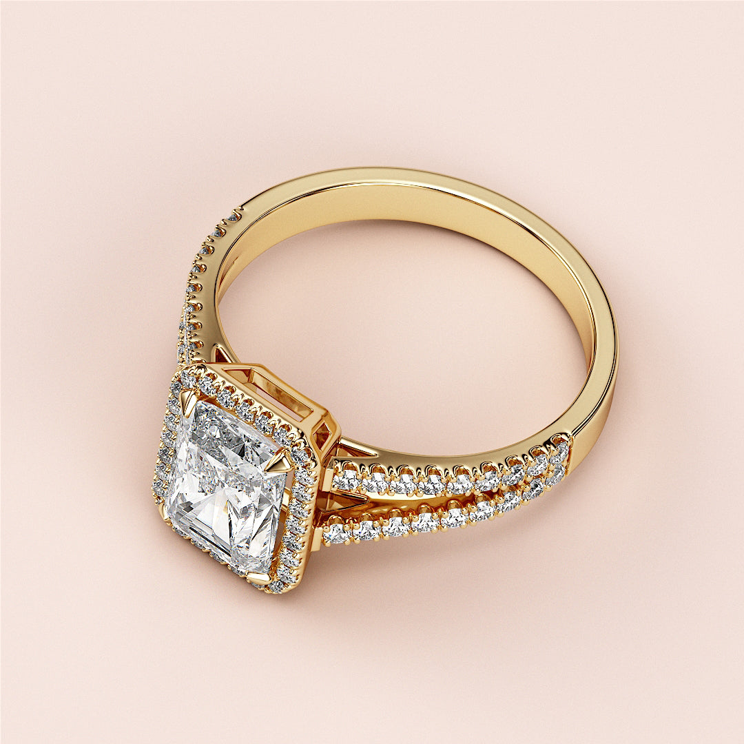 Elegant 14K yellow gold engagement ring featuring a radiant cut diamond andPave diamonds along the cathedral band.