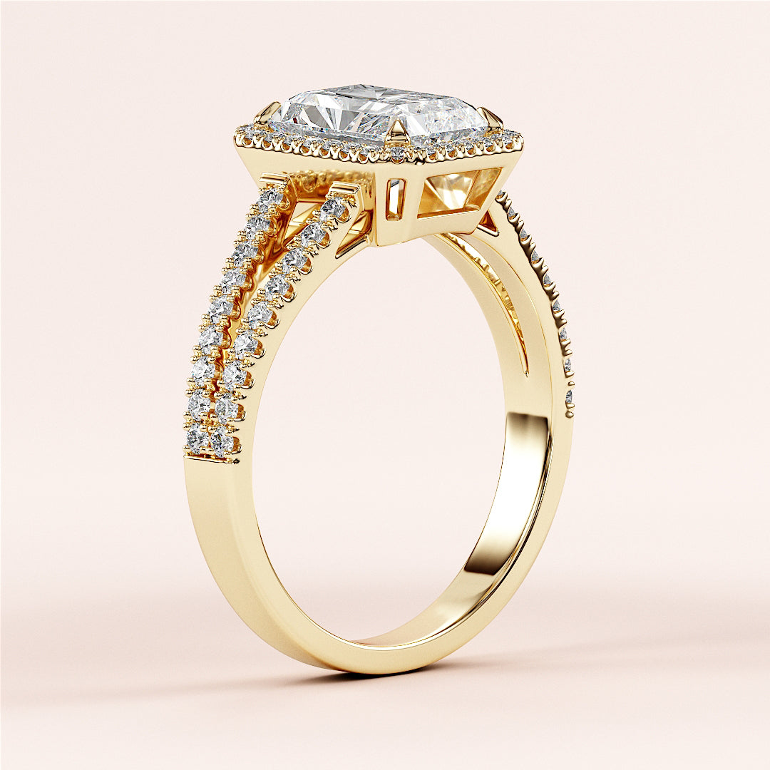 Close-up of an elegant Yellow Gold 14K engagement ring with a radiant-cut diamond and pave band, enhancing its brilliance.
