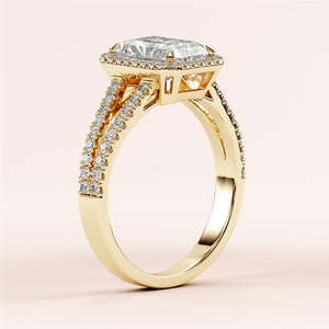 Close-up of an elegant Yellow Gold 14K engagement ring with a radiant-cut diamond and pave band, enhancing its brilliance.