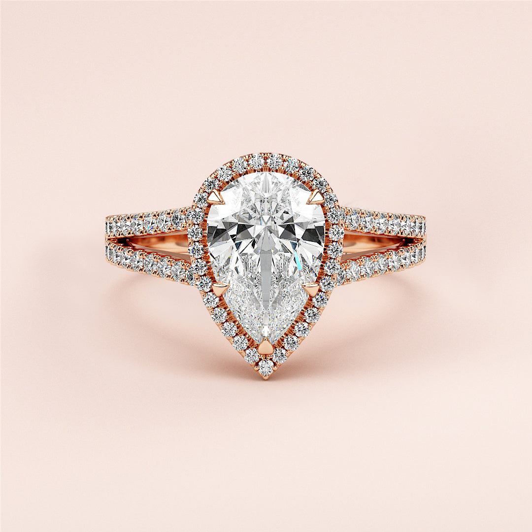 Elegant 14K or 18K rose gold pear-shaped diamond engagement ring with split shank and pave band, featuring dazzling accents.|







#14KRecycledRoseGold
#18KRecycledRoseGold


