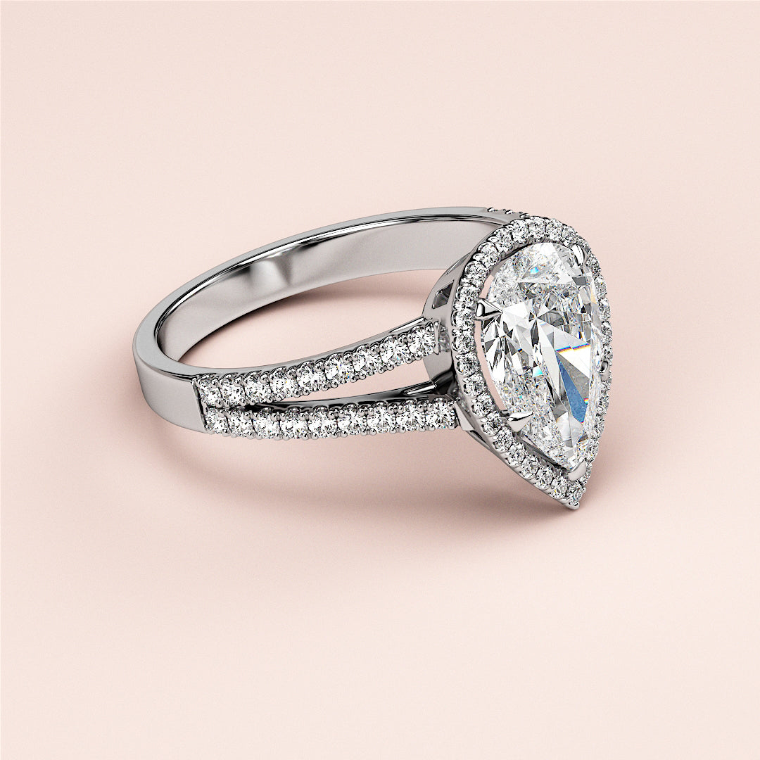 Luxurious pear-shaped diamond engagement ring in 14K/18K white gold, featuring intricate halo and split shank design.|

#14KRecycledWhiteGold
#18KRecycledWhiteGold








#Platinum