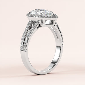 "Elegant 14K or 18K white gold engagement ring with pear halo and pave band, featuring a stunning diamond center stone."
