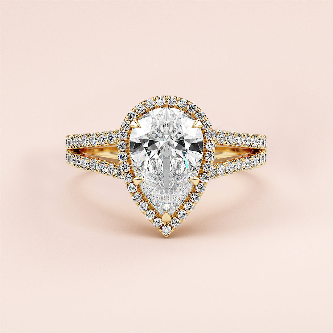 "Elegant 14K or 18K yellow gold pear-shaped engagement ring with diamond halo and split shank, perfect for forever."|




#14KRecycledYellowGold
#18KRecycledYellowGold





