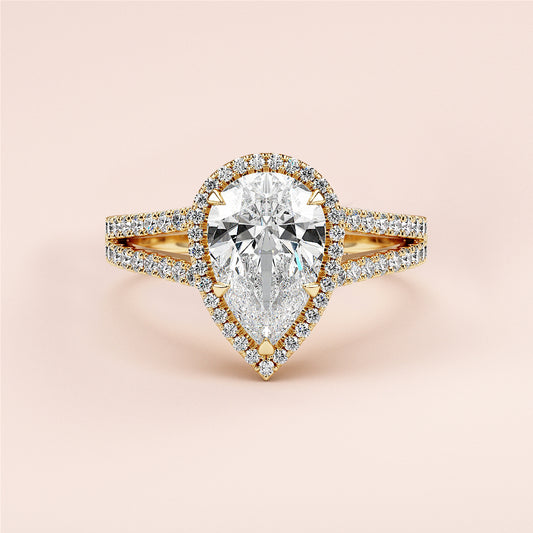 "Elegant 14K or 18K yellow gold pear-shaped engagement ring with diamond halo and split shank, perfect for forever."