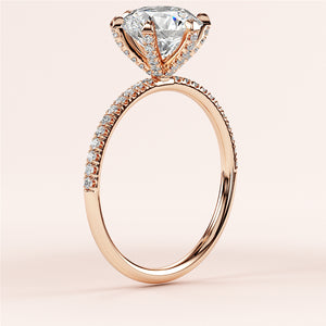 Rose gold engagement ring with heart-shaped diamond center and pave accents on a 14K or 18K gold band, displayed without a model.