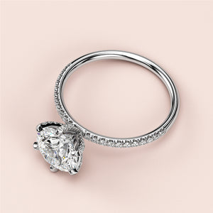 "Elegant 14K or 18K white gold engagement ring with round solitaire andPave accents. Not worn on a model."