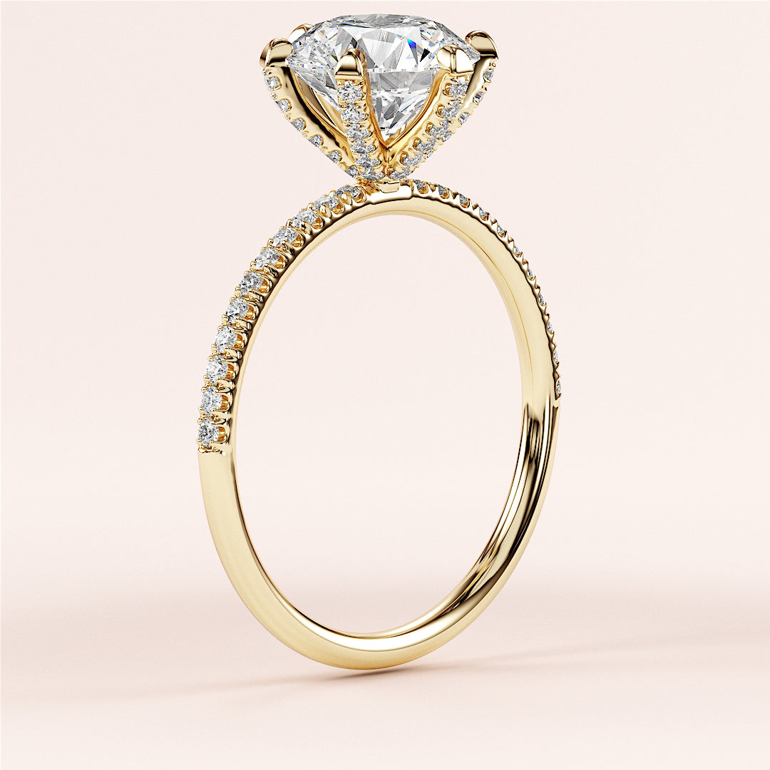 Elegant 14K or 18K gold engagement ring with a heart-shaped diamond andPave-set band, displayed on a neutral background.