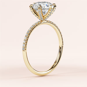 Elegant 14K or 18K gold engagement ring with a heart-shaped diamond andPave-set band, displayed on a neutral background.