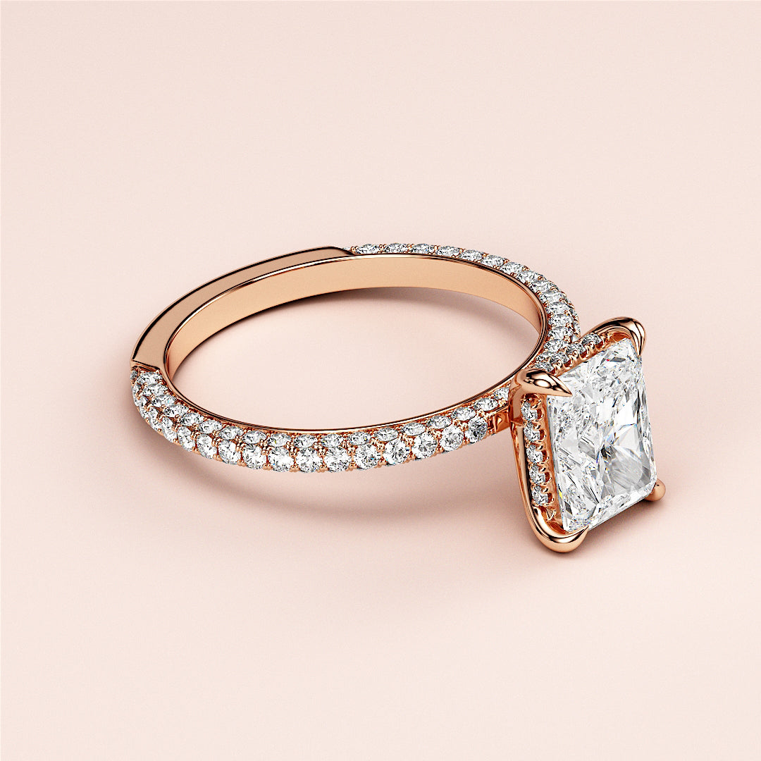 Radiant-cut diamond engagement ring with pave-set band in 14K Rose Gold, 18K, and platinum for a timeless elegance.|







#14KRecycledRoseGold
#18KRecycledRoseGold


