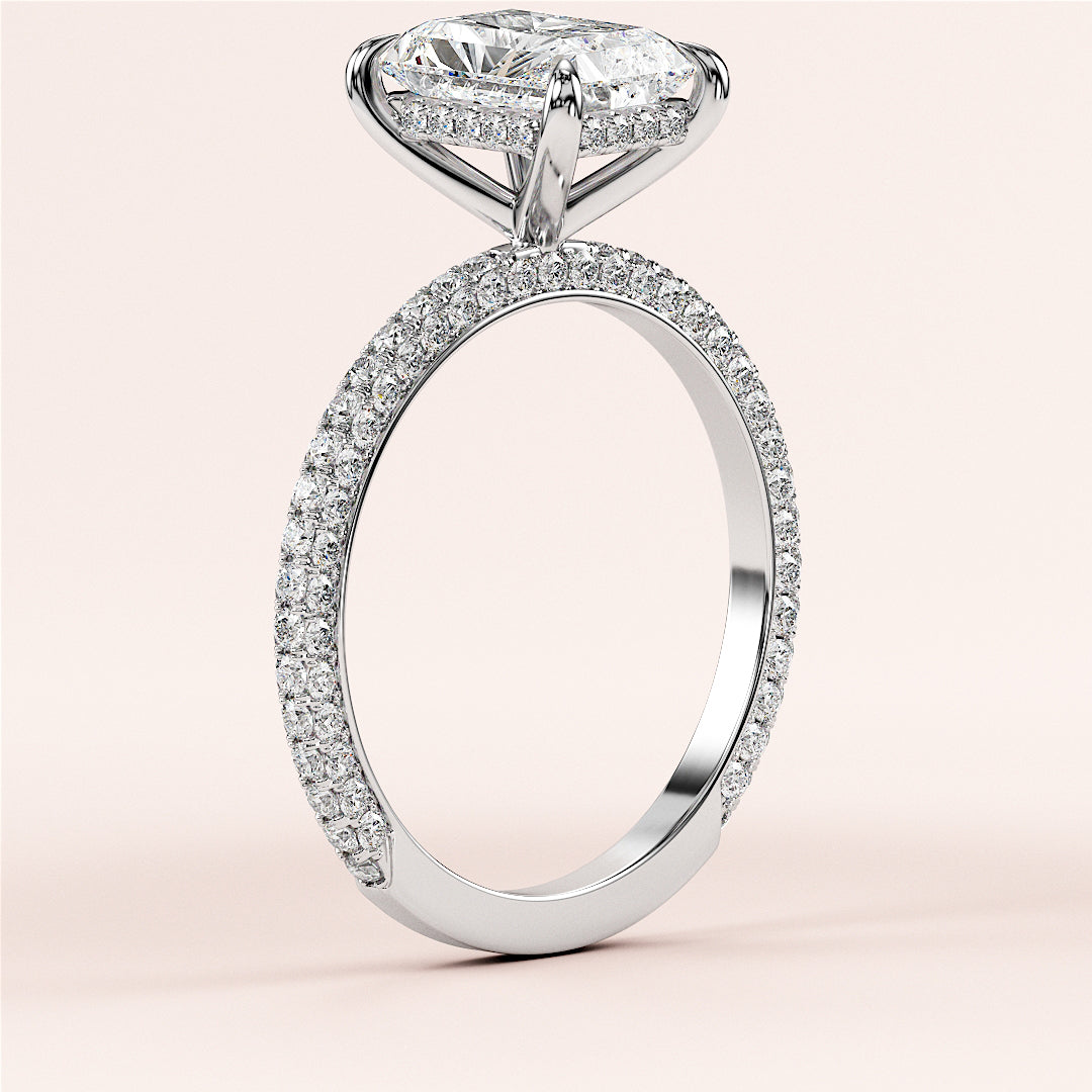 Elegant 14K white gold engagement ring with dazzling oval-cut diamond and pave-set band, side view on a plain background.|

#14KRecycledWhiteGold
#18KRecycledWhiteGold








#Platinum