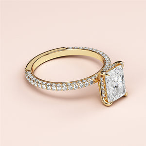Elegant 14K or 18K yellow gold ring featuring a radiant-cut diamond center and shimmeringPave-set band, perfect for timeless sophistication.