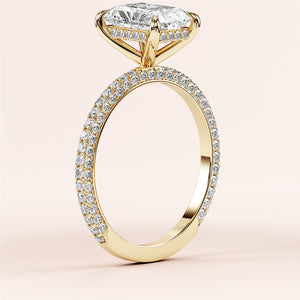 Elegant oval-cut diamond engagement ring in 14K yellow gold with a sparkling halo and pave band, perfect for special moments.