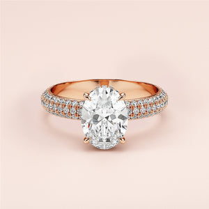 Elegant 14K or 18K rose gold engagement ring with an oval diamond and accent stones, perfect for a timeless proposal.