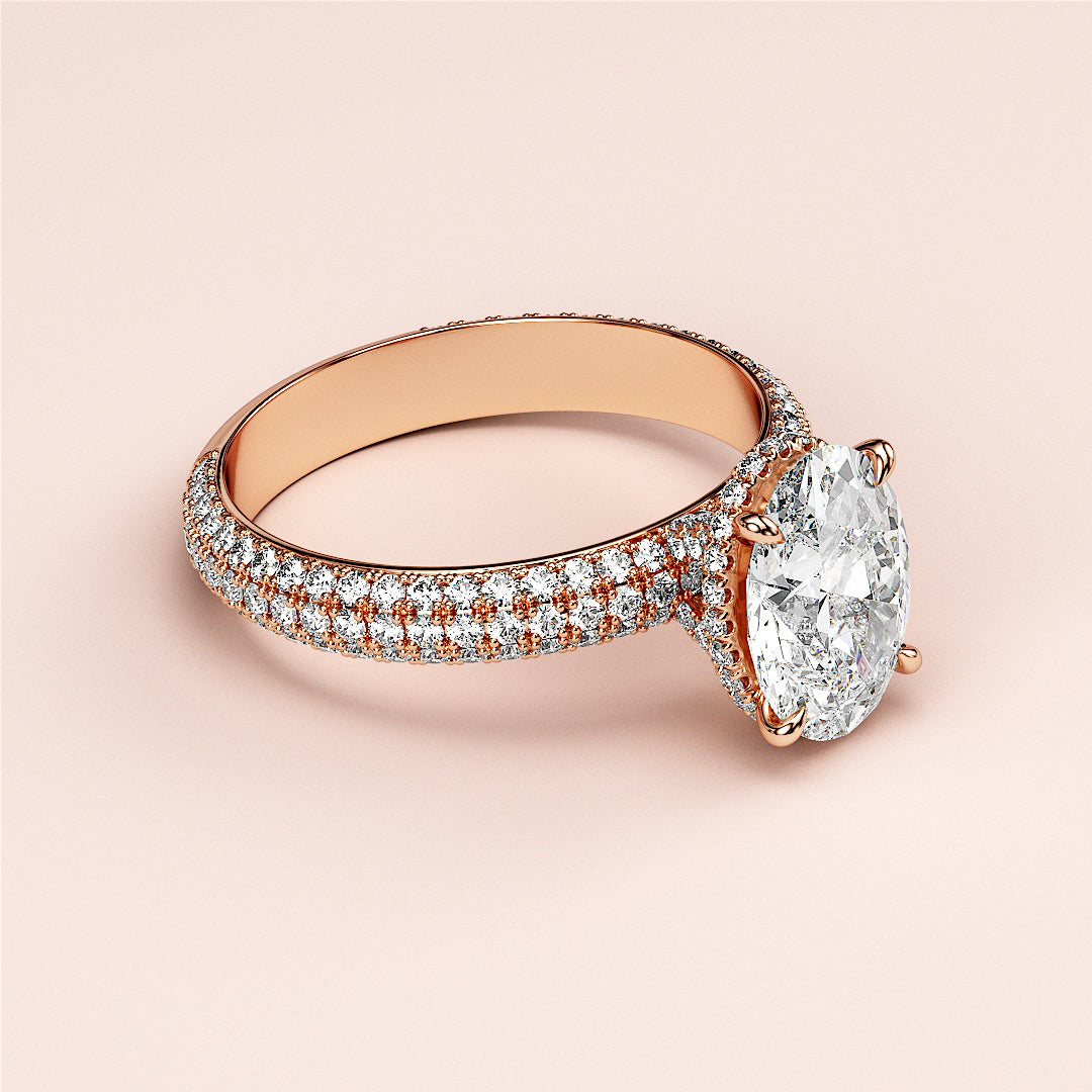 Elegant 14K rose gold engagement ring featuring an oval diamond center with hidden halo and pave diamond accents.|







#14KRecycledRoseGold
#18KRecycledRoseGold


