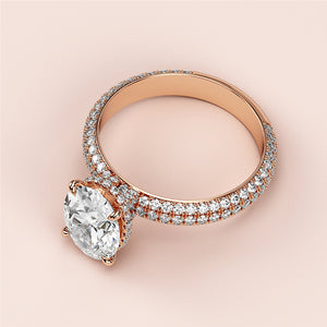 Elegant oval hidden halo engagement ring in 14K or 18K rose gold with dazzlingPave-set diamonds.