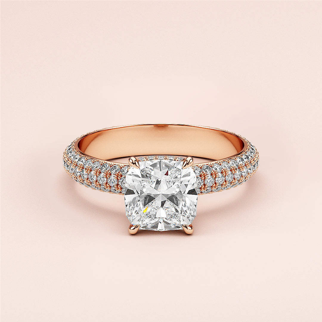 Elegant 14K or 18K rose gold cushion cut diamond engagement ring with pave band and dual row side diamonds, perfect symbol of love.|







#14KRecycledRoseGold
#18KRecycledRoseGold


