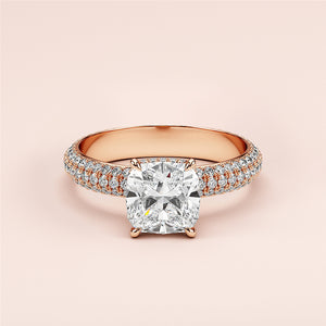 Elegant 14K or 18K rose gold cushion cut diamond engagement ring with pave band and dual row side diamonds, perfect symbol of love.