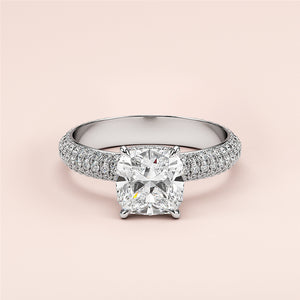 Elegant 14K white gold cushion-cut diamond engagement ring with pave-set band, hidden halo accents for a timeless look.