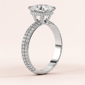 Elegant 14K white gold engagement ring with marquise-cut diamond and pave accents, showcasing a luxurious design.