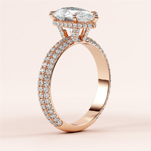 14K or 18K rose gold engagement ring with marquise diamond center and diamond accents, not worn on model.