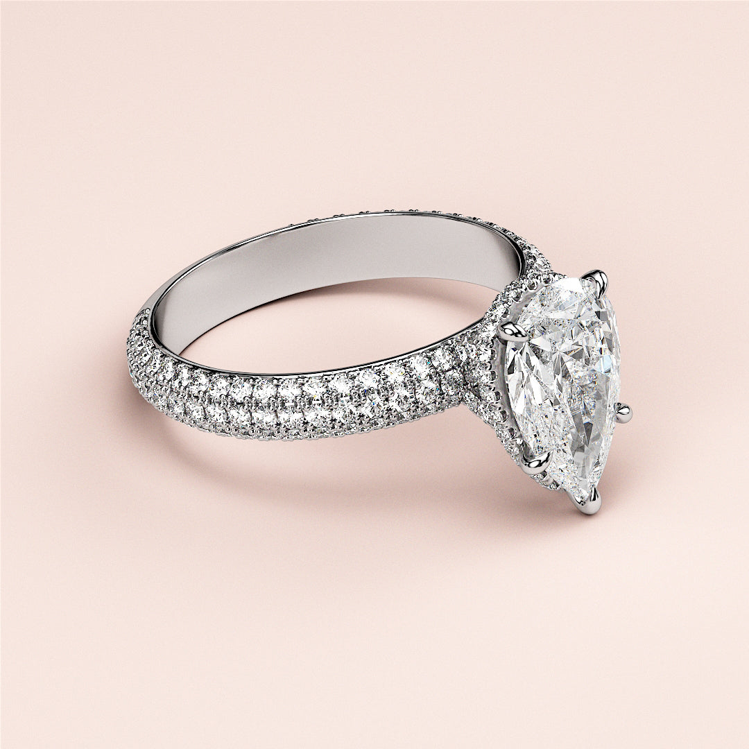 Luxury pear-shaped diamond engagement ring with hidden halo accents, available in 14K or 18K gold and platinum.|

#14KRecycledWhiteGold
#18KRecycledWhiteGold








#Platinum