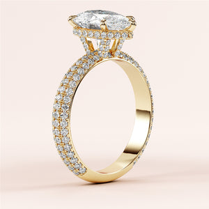 14K yellow gold engagement ring with a pear-shaped diamond andPave accents, showcasing a luxurious and elegant design.