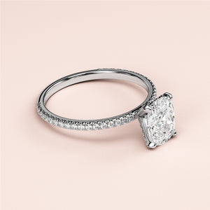 Elegant 14K or 18K white gold engagement ring with oval solitaire diamond and a dazzling pave band. No model shown.