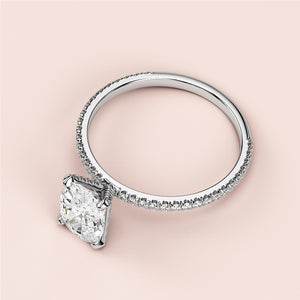 Elegant oval solitaire engagement ring withPave band in 14K/18K white gold or platinum, featuring exceptional sparkle.