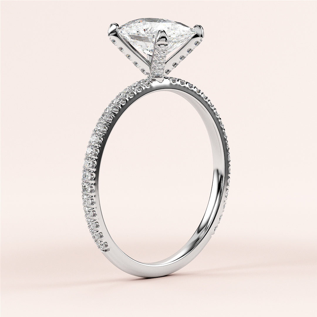 Elegant engagement ring in 14K or 18K white gold, featuring a shield-shaped diamond andPave accents on a knife-edge band. |

#14KRecycledWhiteGold
#18KRecycledWhiteGold








#Platinum
