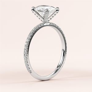 Elegant engagement ring in 14K or 18K white gold, featuring a shield-shaped diamond andPave accents on a knife-edge band. 