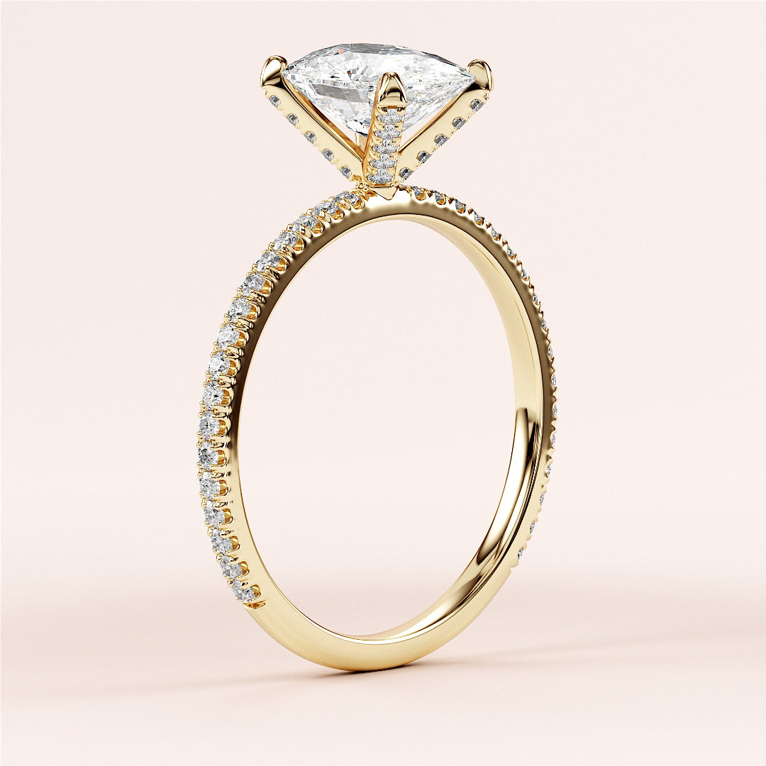Elegant 14K yellow gold engagement ring with oval solitaire andPave accents, showcasing brilliant diamonds and intricate details.|




#14KRecycledYellowGold
#18KRecycledYellowGold





